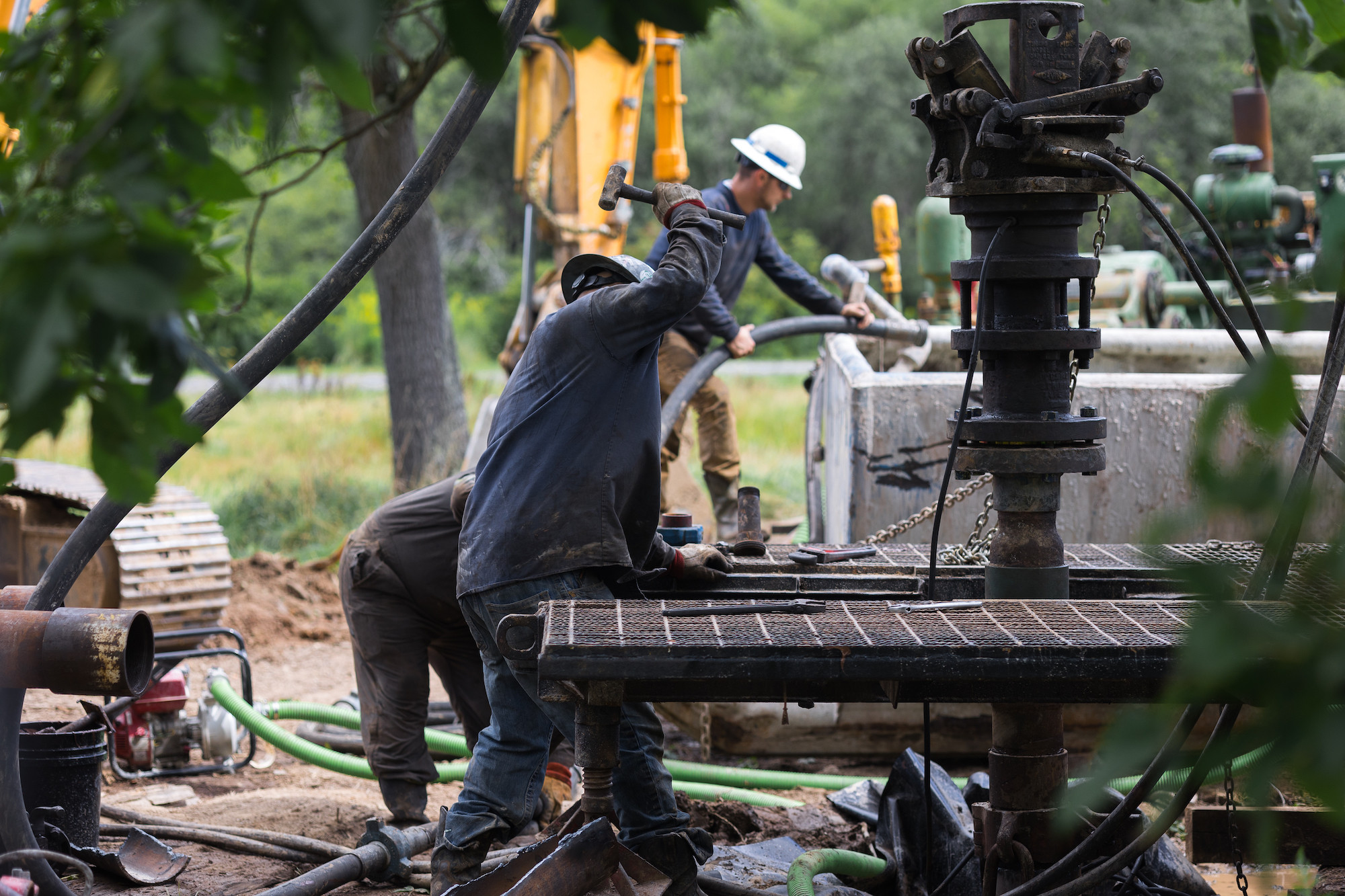 Crew working on an orphan oil and gas well closure